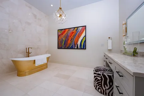 a bathroom with a sink a bathtub and a shower