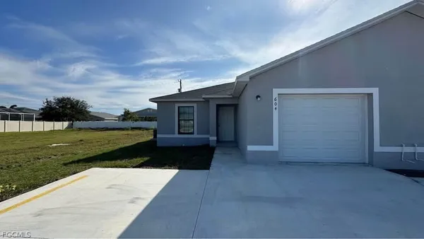 a view of a house with a garden
