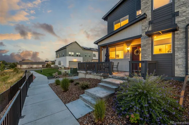 a view of swimming pool with outdoor seating and plants