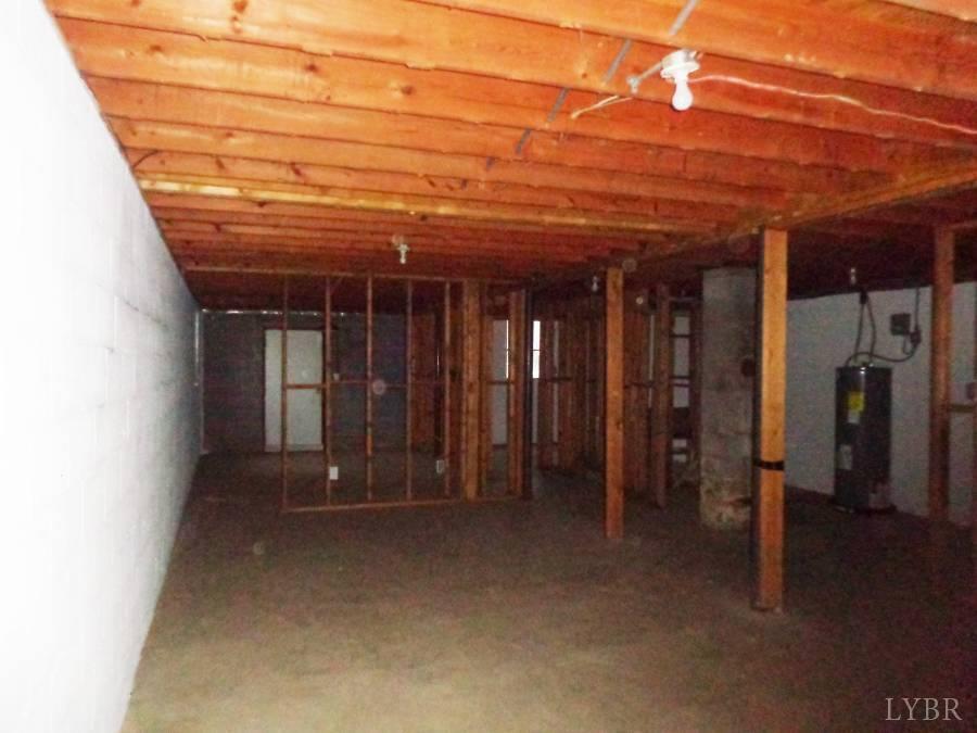 1136 Staunton Hill Road Brookneal, VA 24528 - Photo 18 of 22 a view of a room with wooden floor