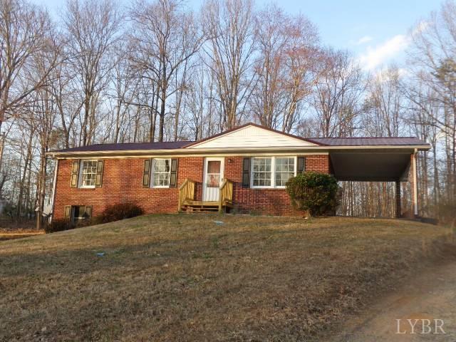 1136 Staunton Hill Road Brookneal, VA 24528 - Photo 2 of 22 a front view of a house with a yard