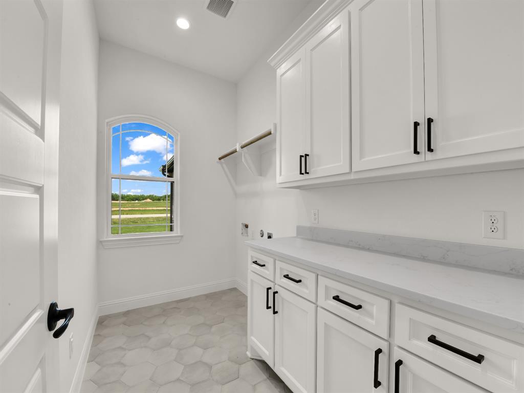 143 Desperado Way Weatherford, TX 76088 - Photo 29 of 36 Washroom with cabinet space, washer hookup, recessed lighting, and baseboards