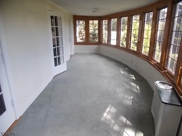 a view of entryway and hall with a window