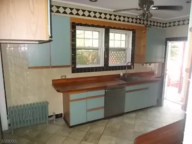 a kitchen with a sink and a window