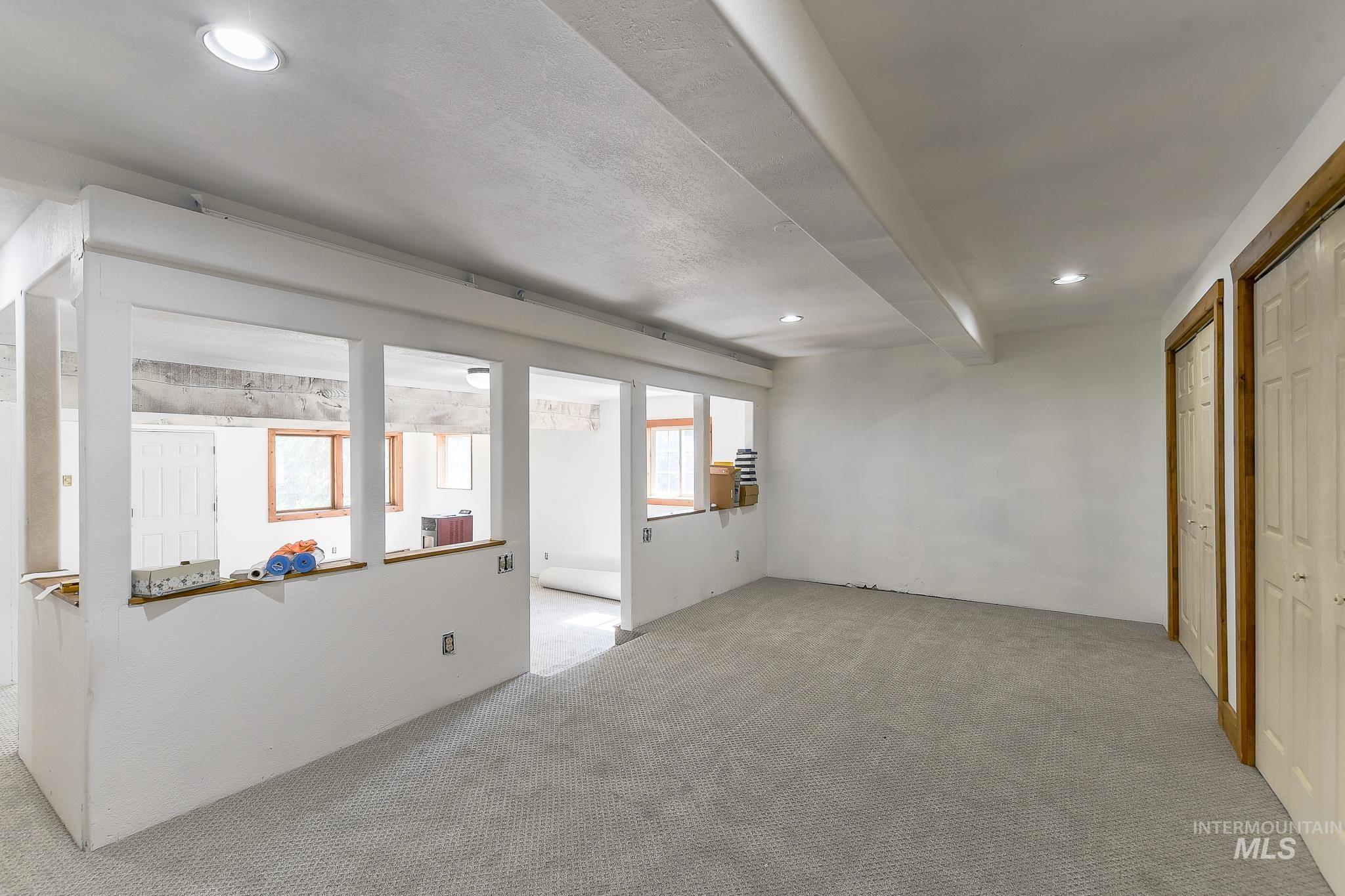1045 Joyce Road Moscow, ID 83843 - Photo 40 of 50 Recessed lighting, wood-finish window frames, and two sets of paneled doors with wood-finish trim