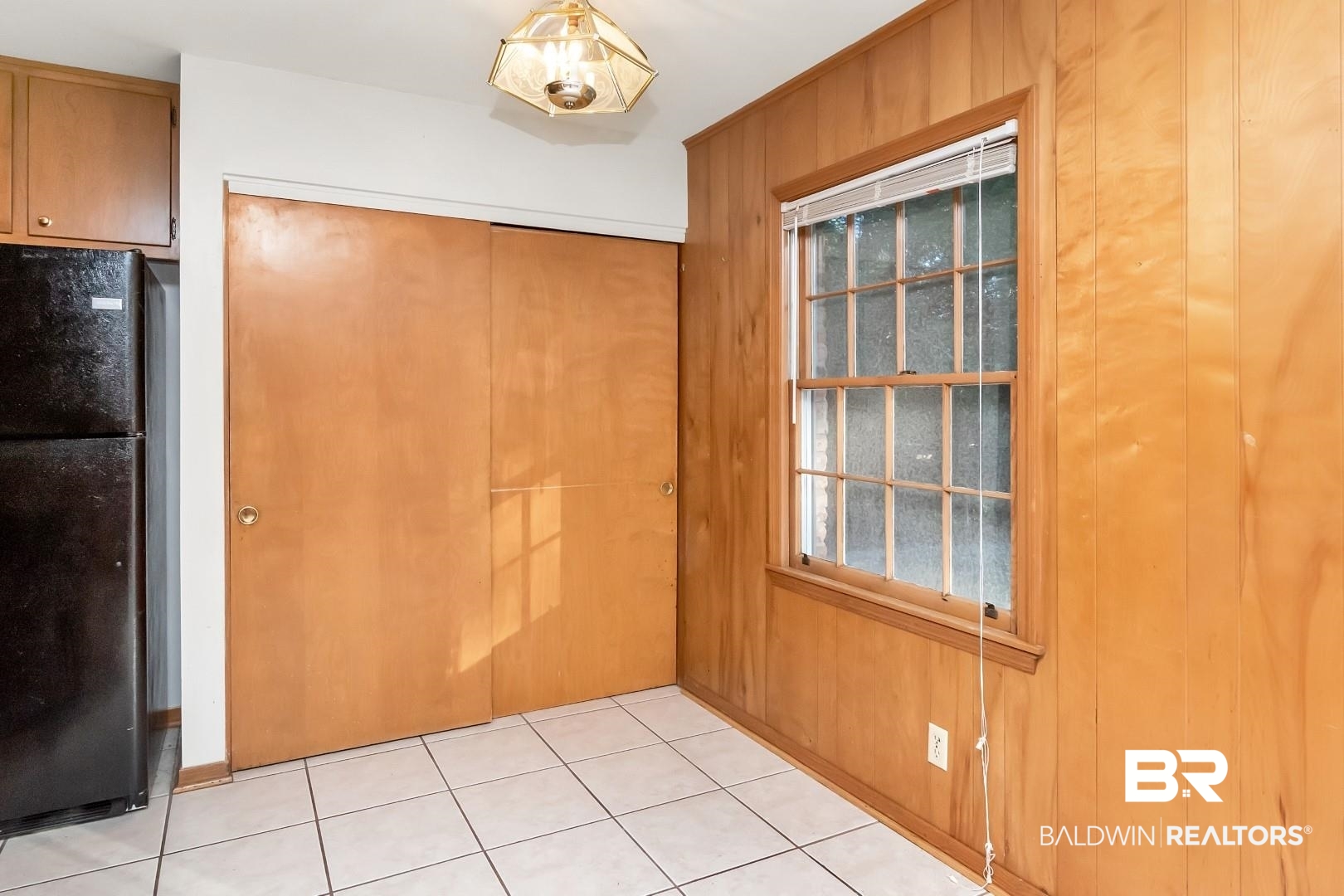 5517 Vanderbilt Drive Mobile, AL 36608 - Photo 16 of 33 Entryway featuring light tile patterned flooring and wood walls