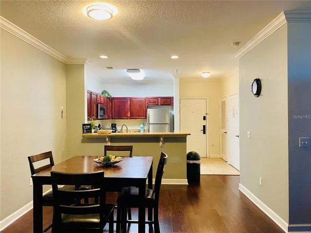 a kitchen with a table and chairs in it