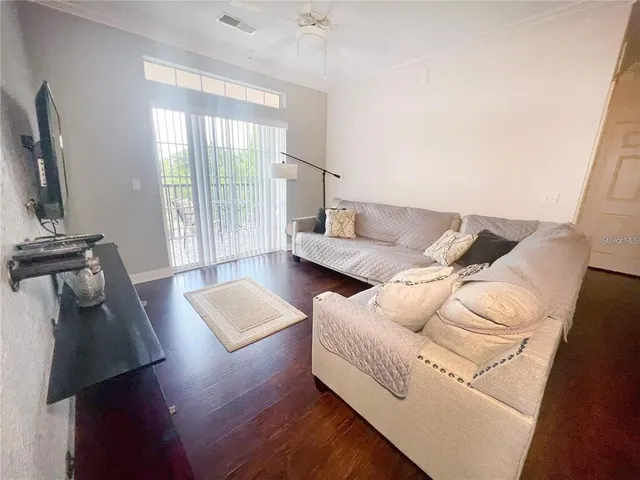 a living room with furniture and a window