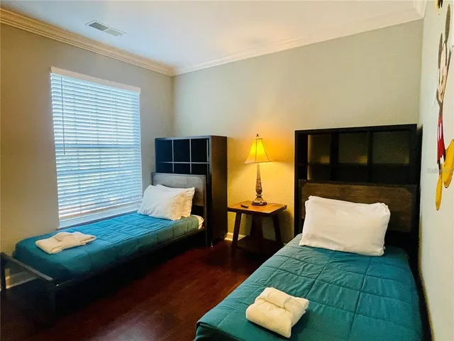 a bedroom with a bed and window