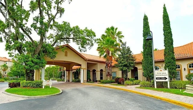 a front view of a building with a garden