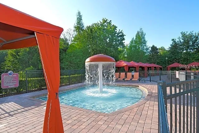 a patio with table and chairs