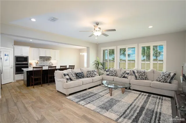 a living room with furniture and a large window