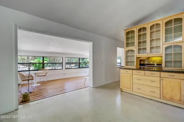 a kitchen with stainless steel appliances granite countertop a stove and a microwave