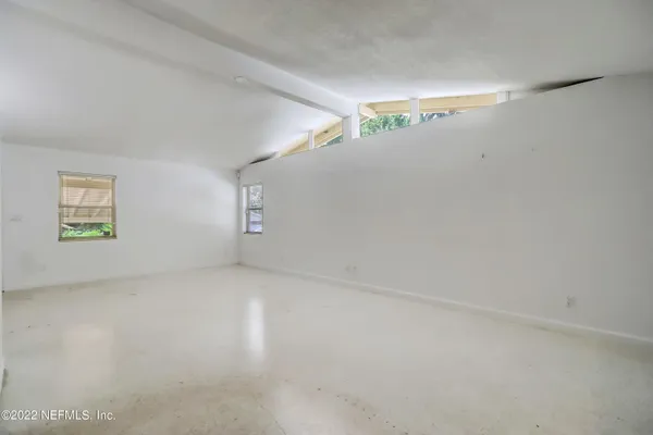 a kitchen with granite countertop cabinets and appliances