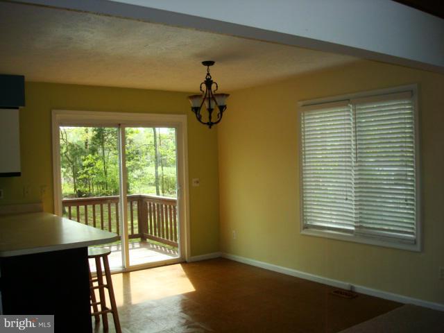 207 Freedom Road Locust Grove, VA 22508 - Photo 6 of 22 Dining Room w/deck beyond