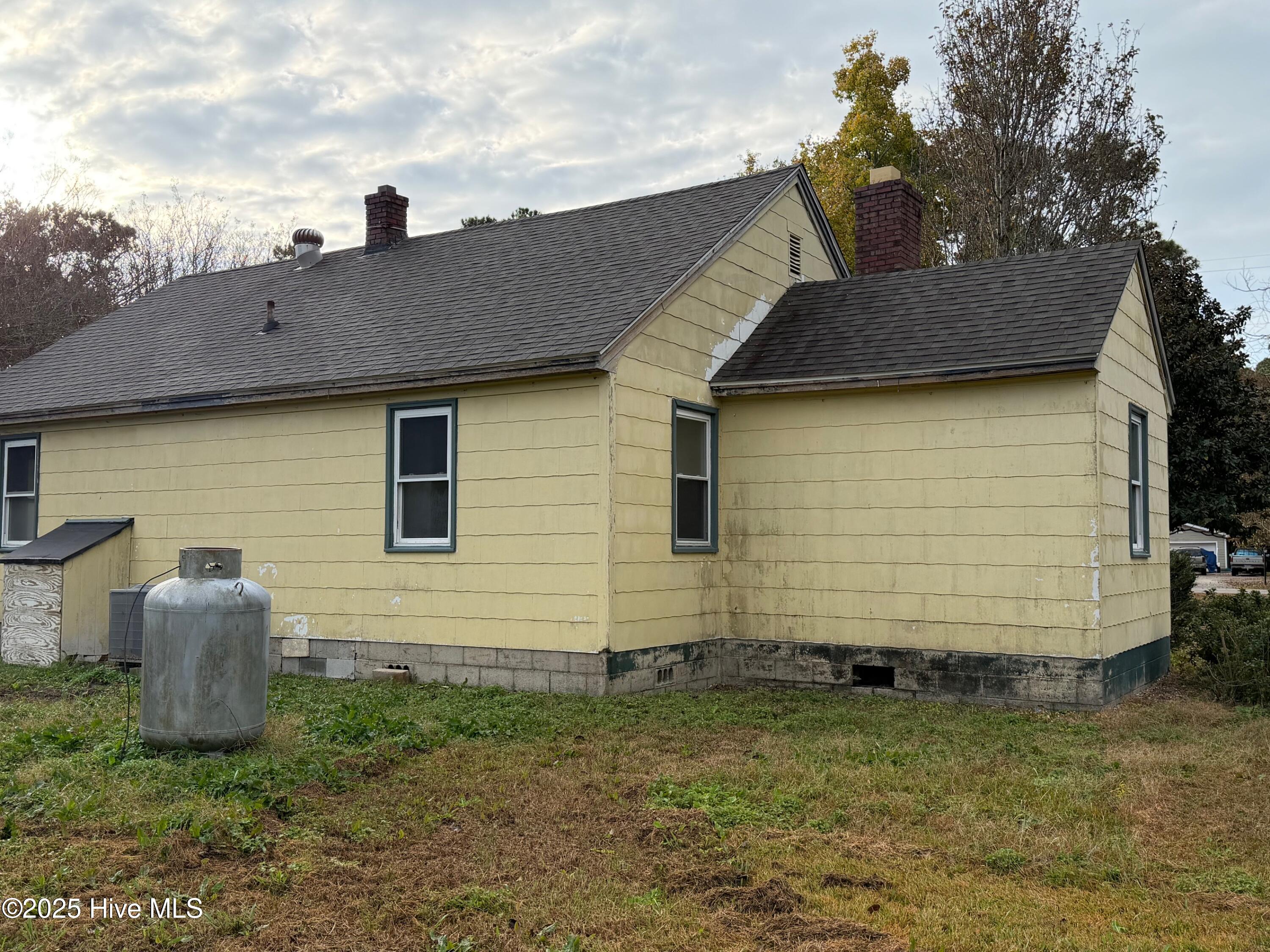 547 Pigott Road Gloucester, NC 28528 - Photo 17 of 18 Rear Septic is in the rear of the house. Gas bottle is for heat