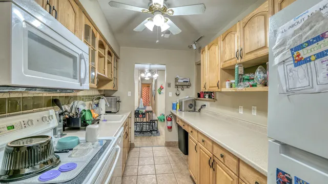 a kitchen with a sink and a stove top oven