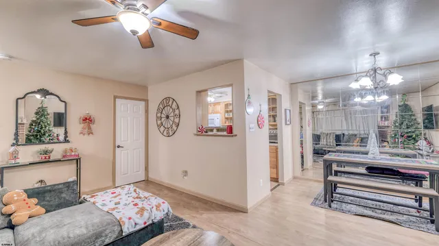 a bedroom with furniture and a chandelier