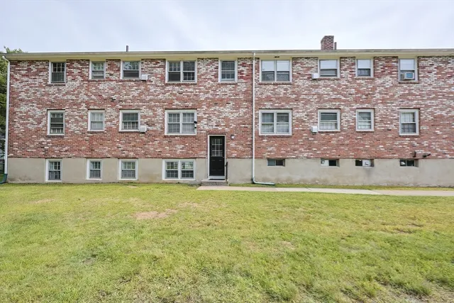 front view of a building with a big yard