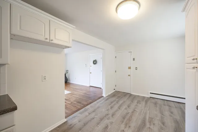 a view of a livingroom with wooden floor