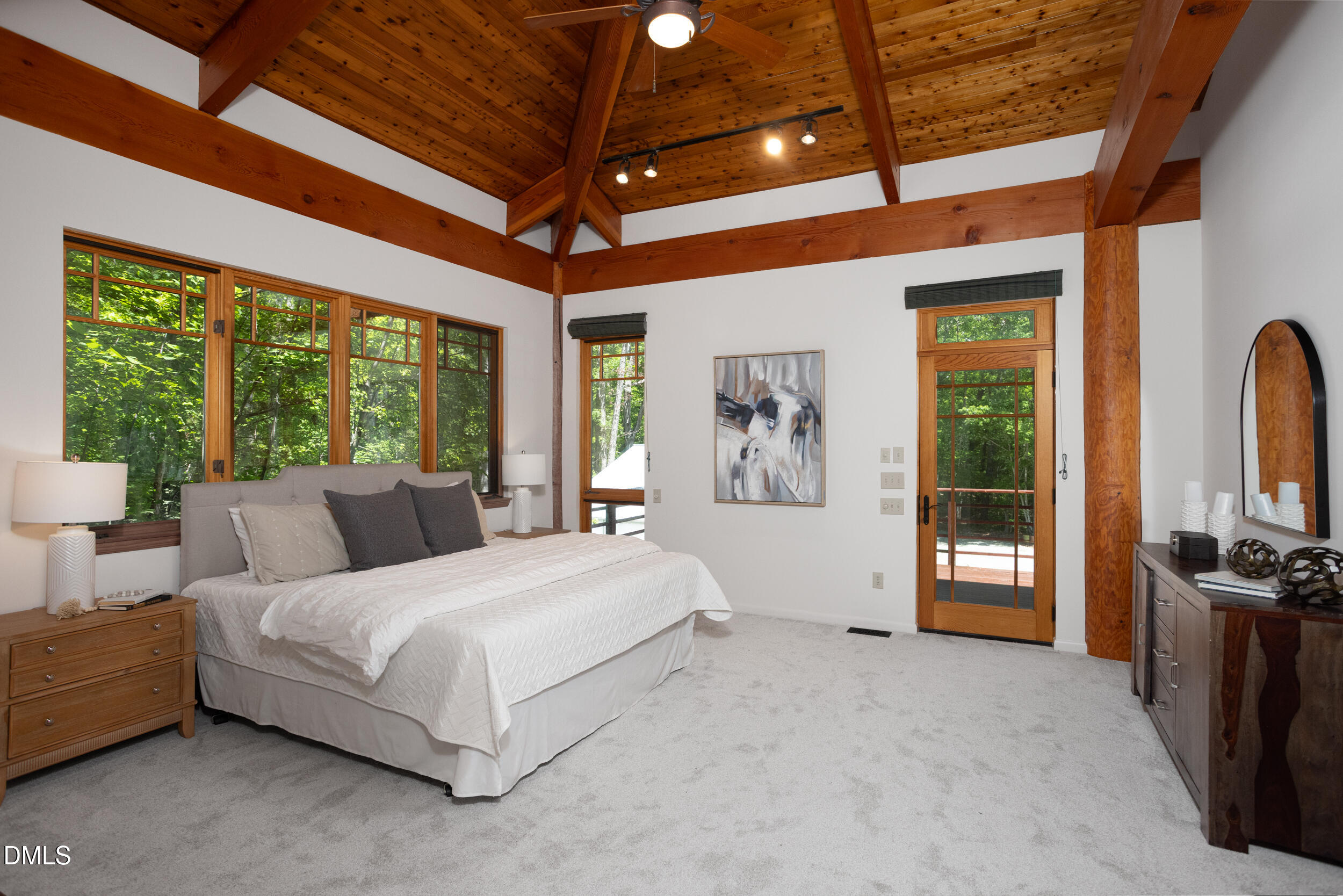 260 Bc Way Rougemont, NC 27572 - Photo 34 of 76 a spacious bedroom with a bed a flat screen tv and balcony