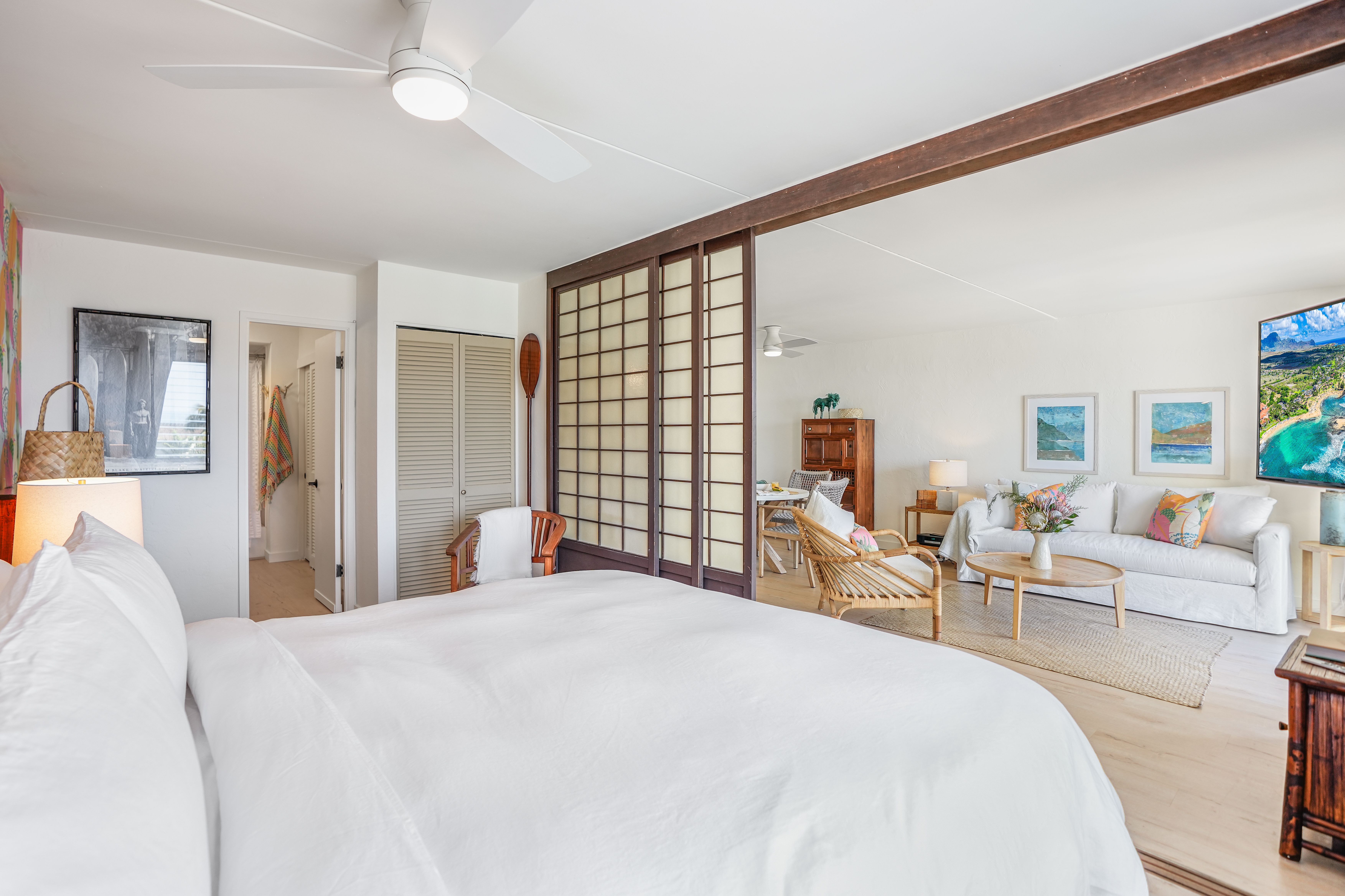 1763 Pe'e Road, Unit 203 Koloa, HI 96756 - Photo 11 of 27 a bedroom with a large bed and a large window