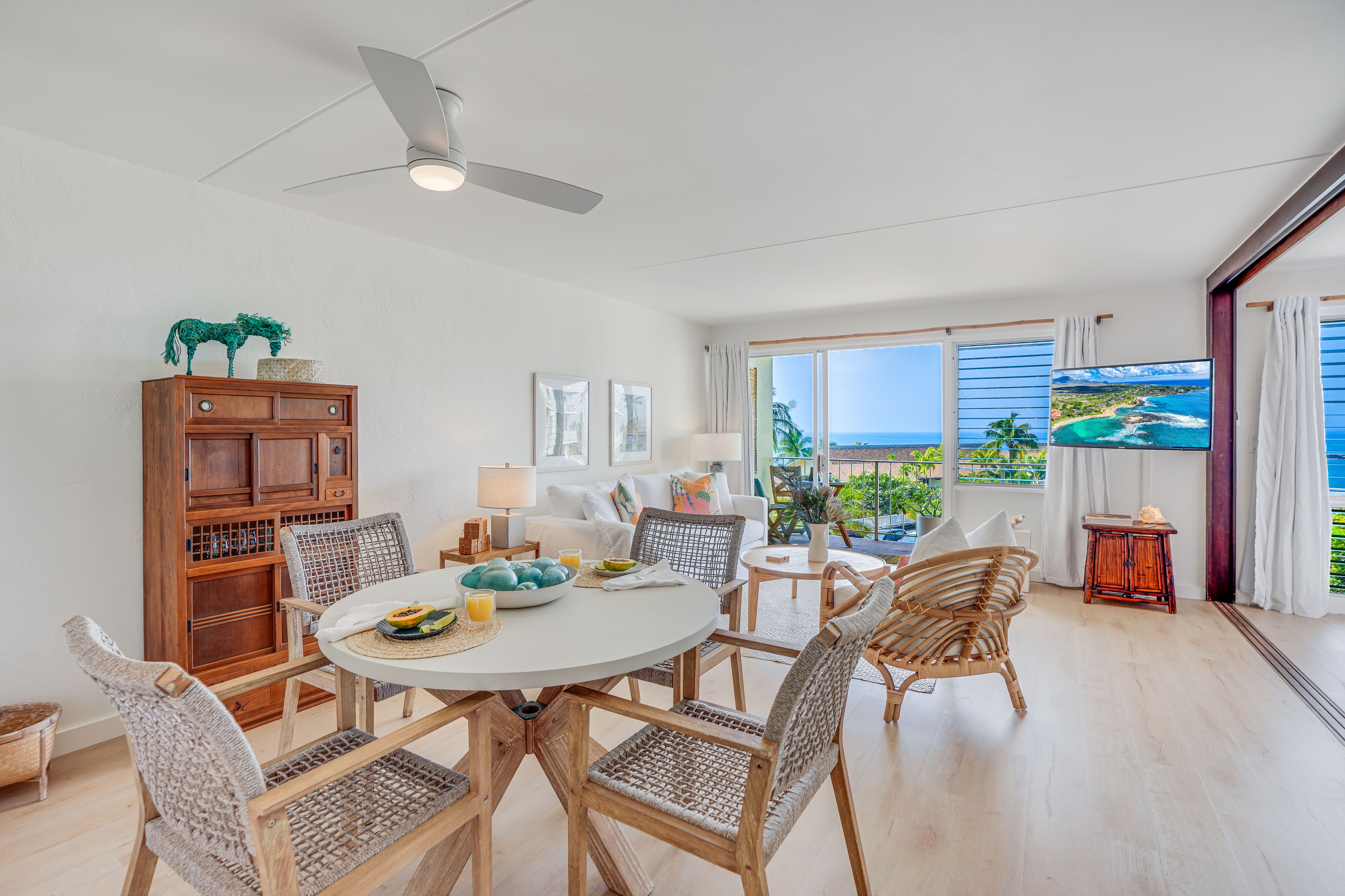 1763 Pe'e Road, Unit 203 Koloa, HI 96756 - Photo 2 of 27 a view of a dining room with furniture window and wooden floor