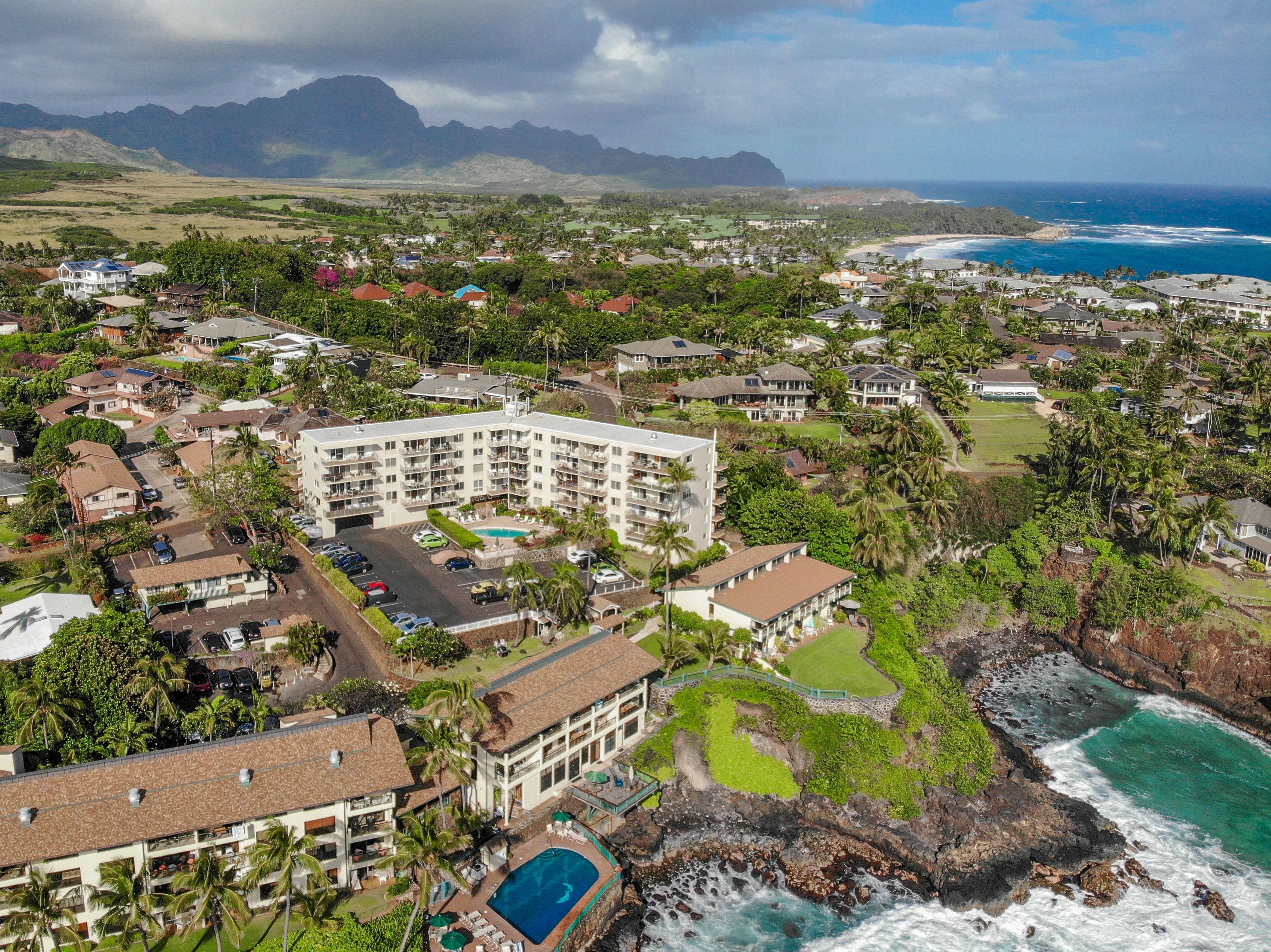 1763 Pe'e Road, Unit 203 Koloa, HI 96756 - Photo 23 of 27 a view of a city with an ocean