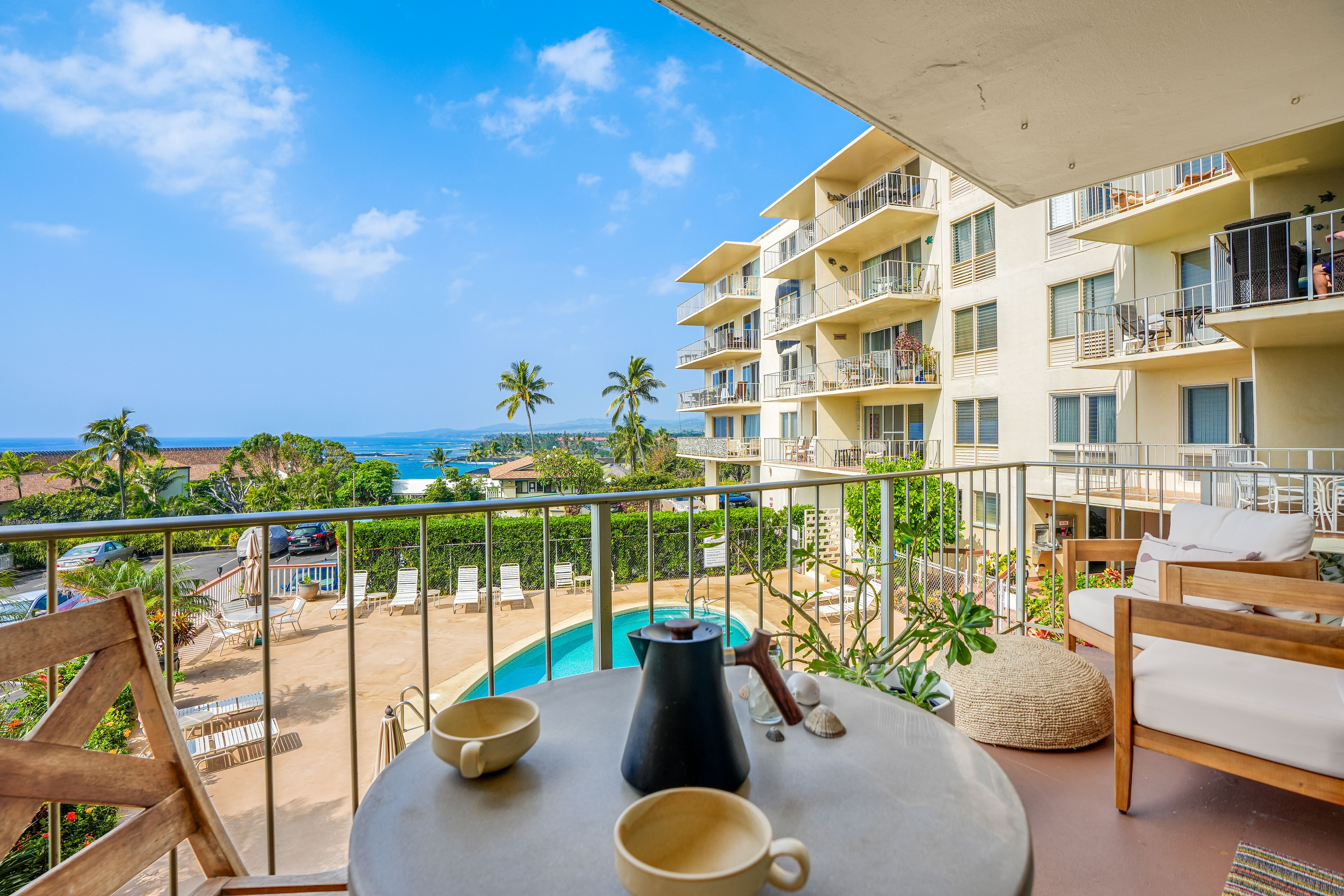 1763 Pe'e Road, Unit 203 Koloa, HI 96756 - Photo 3 of 27 a view of a swimming pool with seating area and furniture