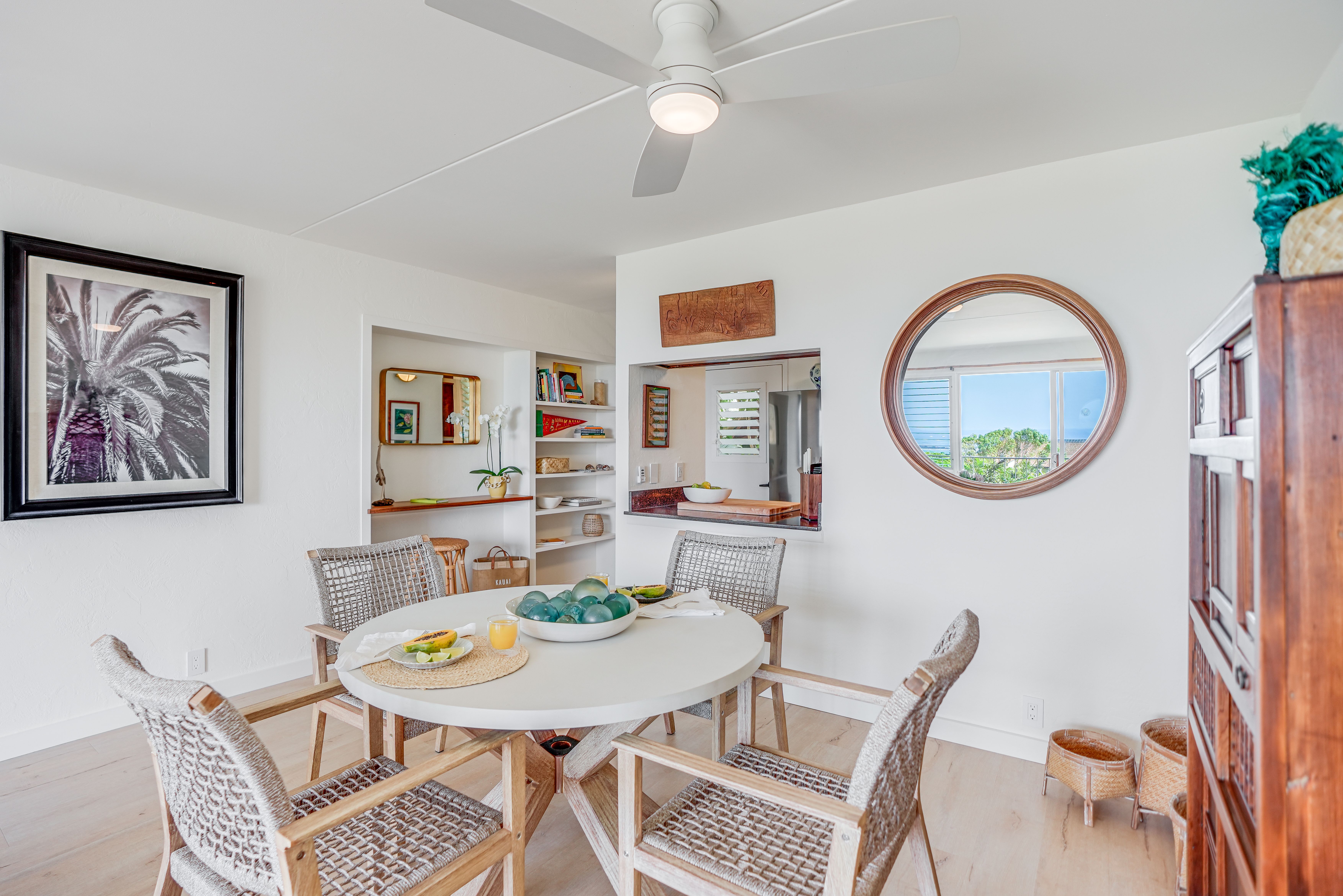 1763 Pe'e Road, Unit 203 Koloa, HI 96756 - Photo 6 of 27 a view of a dining room with furniture and a chandelier
