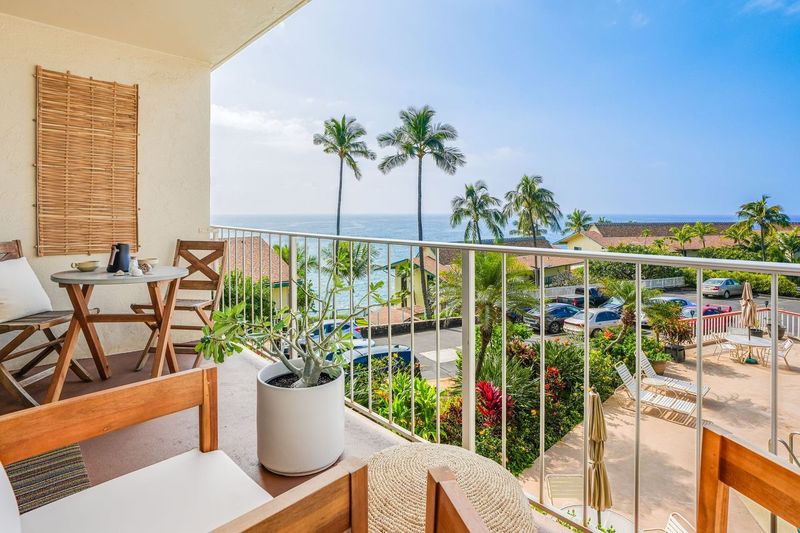 1763 Pe'e Road, Unit 203 Koloa, HI 96756 - Photo 7 of 27 a view of a balcony with chairs and a potted plant