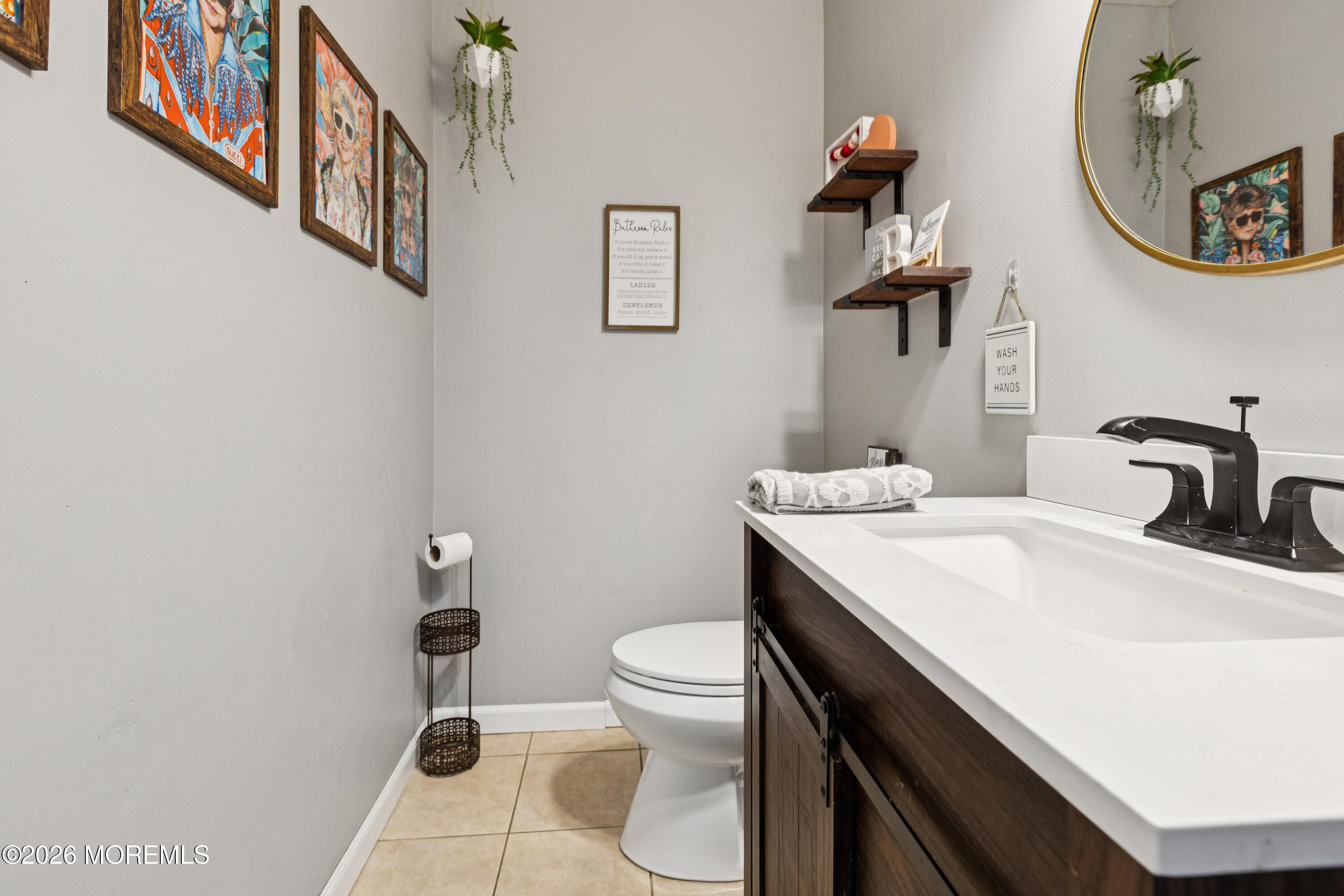 12 Crest Road Jackson, NJ 08527 - Photo 18 of 19 a bathroom with a sink a toilet and a mirror
