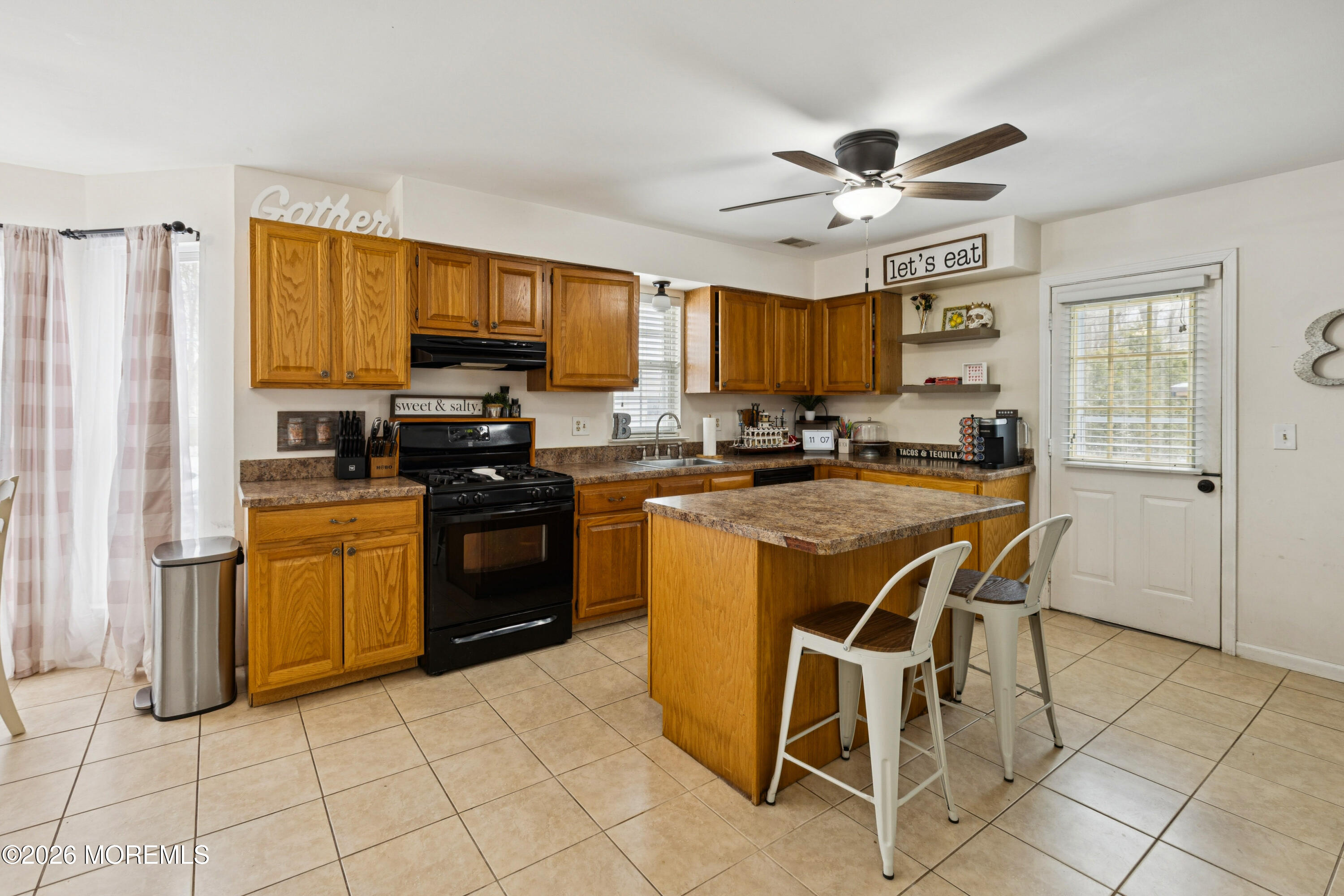 12 Crest Road Jackson, NJ 08527 - Photo 3 of 19 a kitchen with a stove a sink and a refrigerator