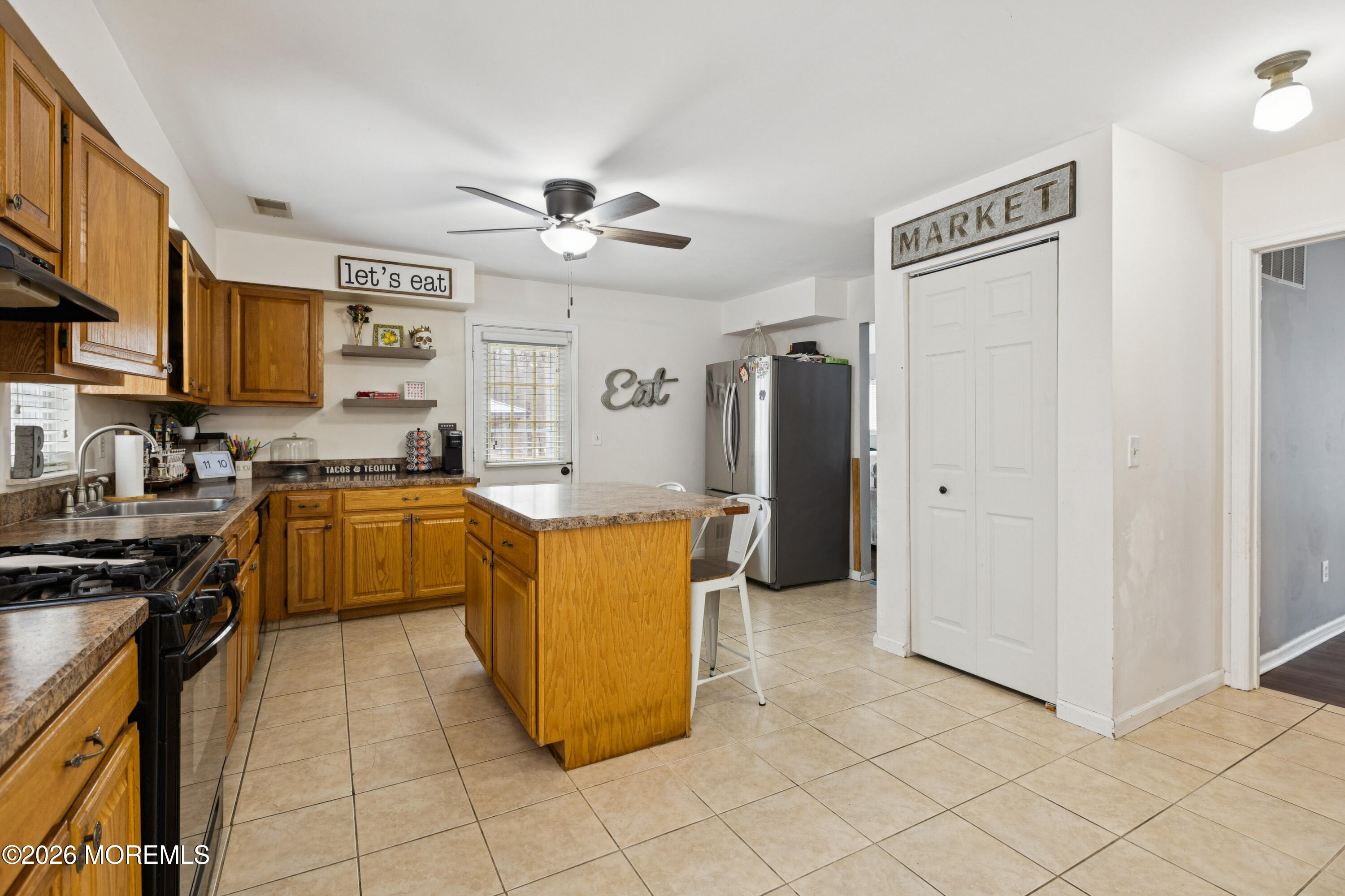 12 Crest Road Jackson, NJ 08527 - Photo 4 of 19 a kitchen with stainless steel appliances granite countertop a stove a sink and a refrigerator