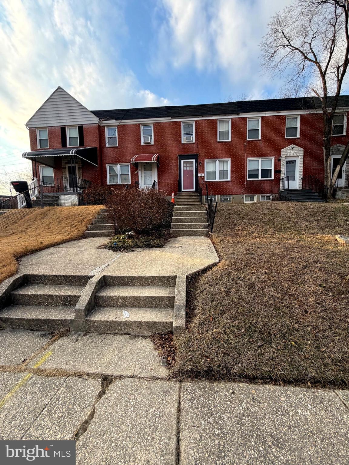 726 South Woodington Road Baltimore, MD 21229 - Photo 3 of 3 a front view of a house with a yard