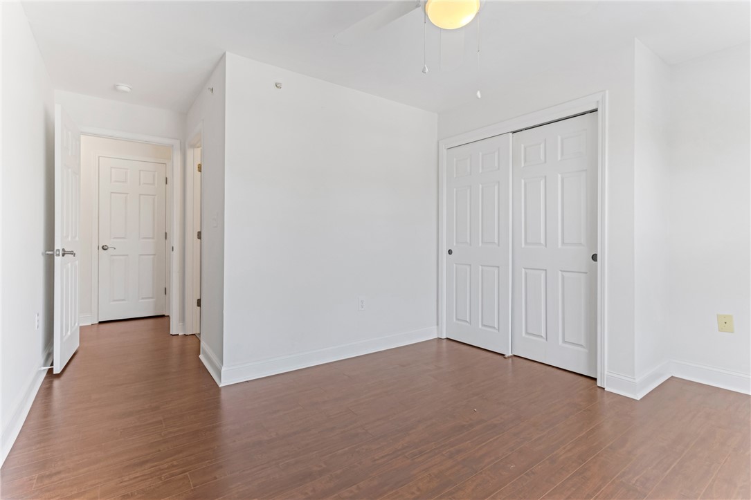 725 Lookover Drive Anderson, SC 29621 - Photo 13 of 31 Rich wood-inspired floors and crisp white walls define this versatile space.