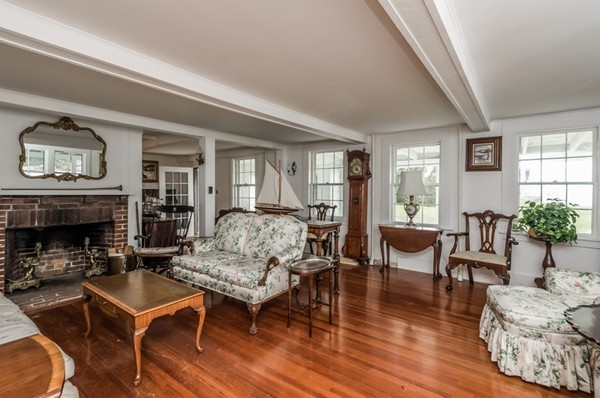 52 Shore Road Gloucester, MA 01930 - Photo 17 of 22 a living room with furniture and a fireplace