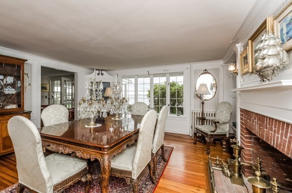 52 Shore Road Gloucester, MA 01930 - Photo 18 of 22 a view of a dining room with furniture wooden floor and chandelier
