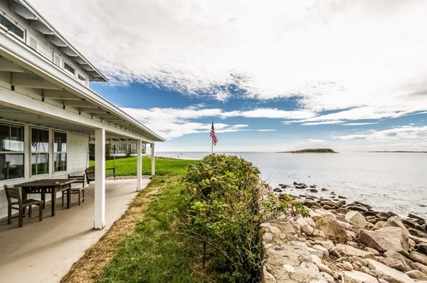52 Shore Road Gloucester, MA 01930 - Photo 5 of 22 a swimming pool with an outdoor seating and a yard
