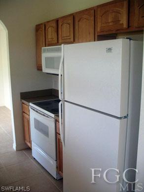4105 26th Street Southwest Lehigh Acres, FL 33976 - Photo 2 of 5 a utility room with dryer and washer
