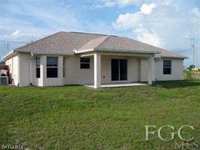 4105 26th Street Southwest Lehigh Acres, FL 33976 - Photo 5 of 5 a view of a house with backyard