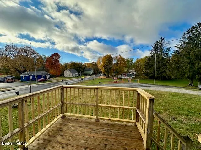 a view of swimming pool with outdoor seating and yard in back