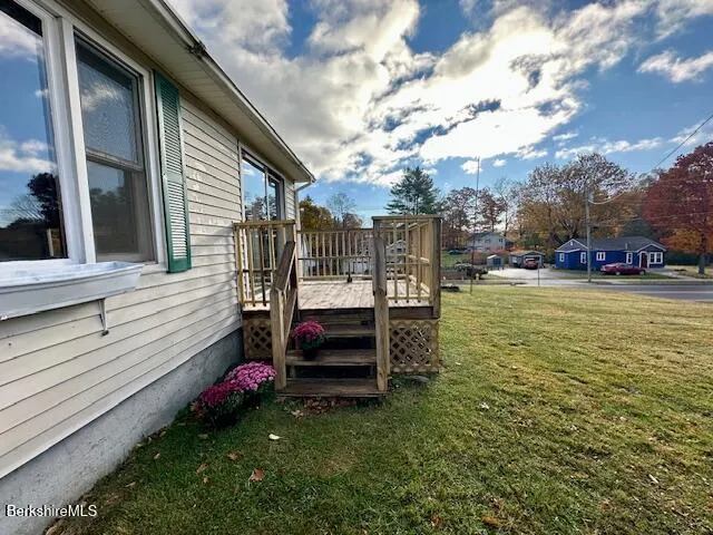 a view of a garden with large trees