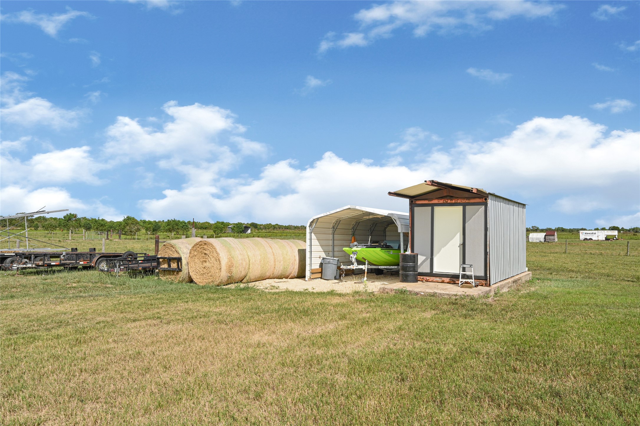 2105 Eagle Road Anahuac, TX 77514 - Photo 23 of 44 a front view of a house with a garden and lake view