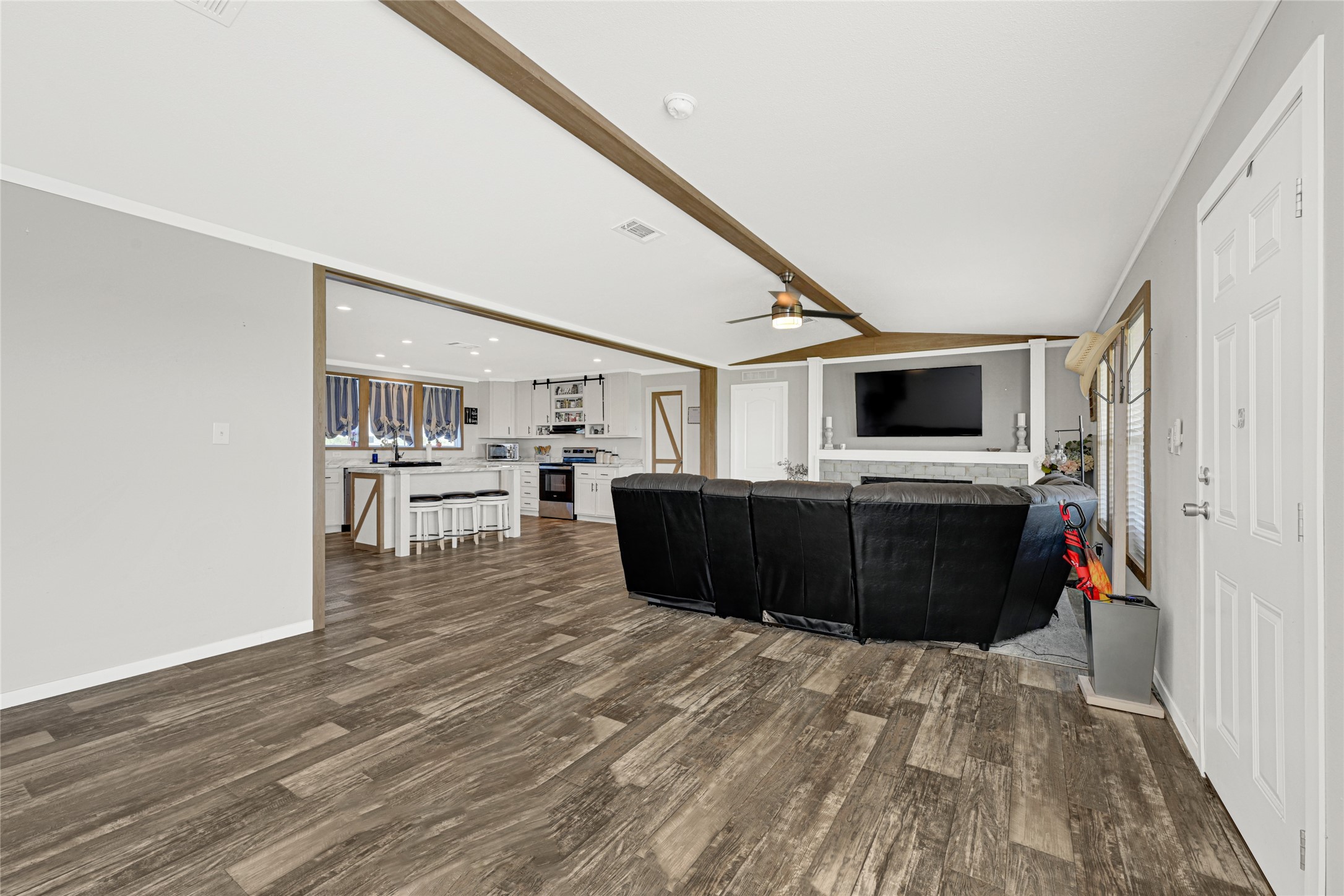 2105 Eagle Road Anahuac, TX 77514 - Photo 27 of 44 a living room with furniture and a flat screen tv