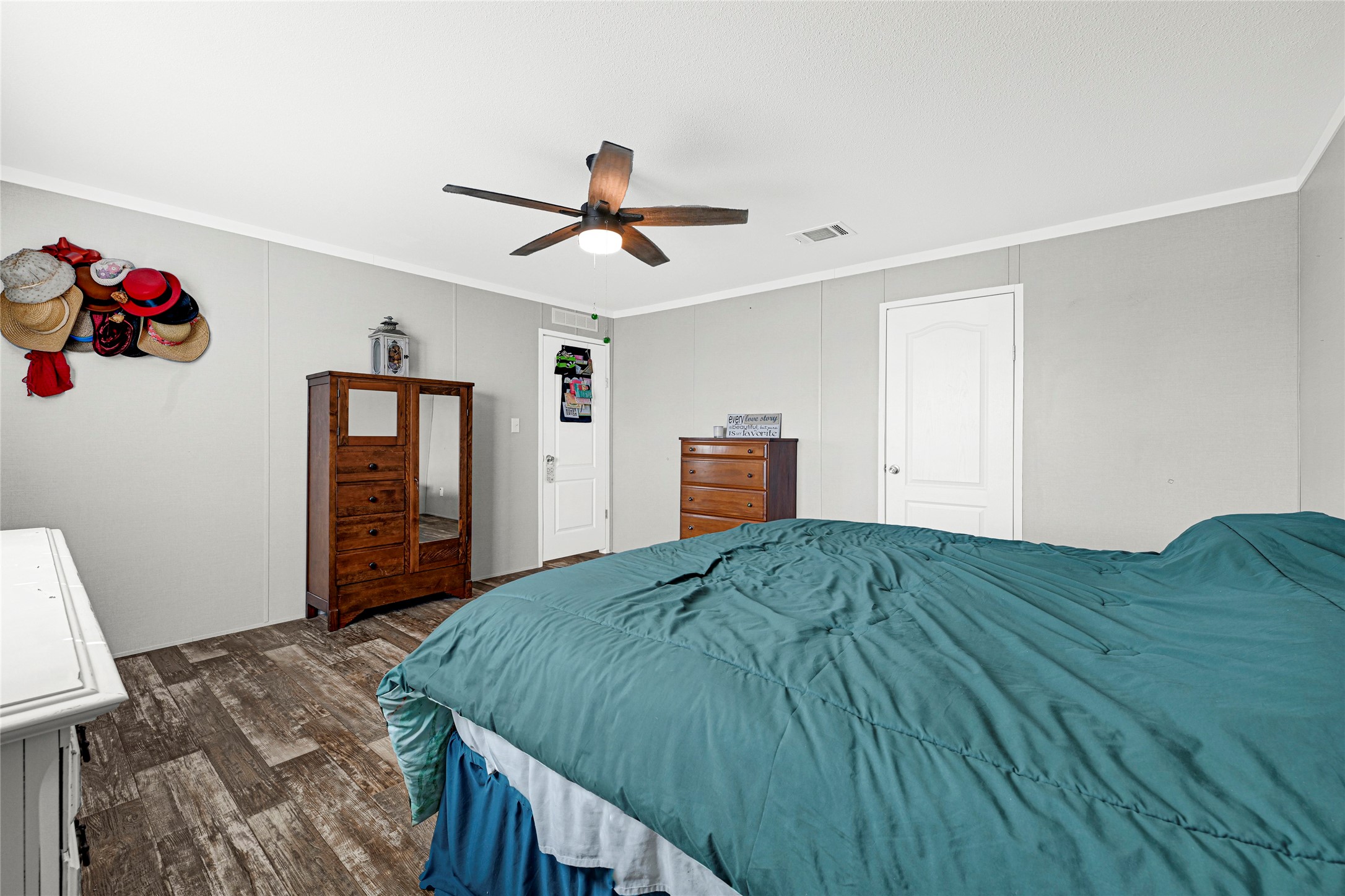2105 Eagle Road Anahuac, TX 77514 - Photo 34 of 44 a bedroom with a bed and dresser