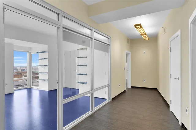 a large kitchen with stainless steel appliances granite countertop a sink a stove and a refrigerator