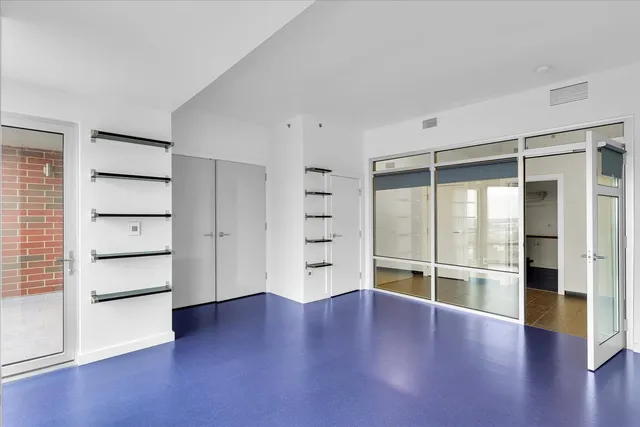a kitchen with stainless steel appliances granite countertop a stove and a microwave