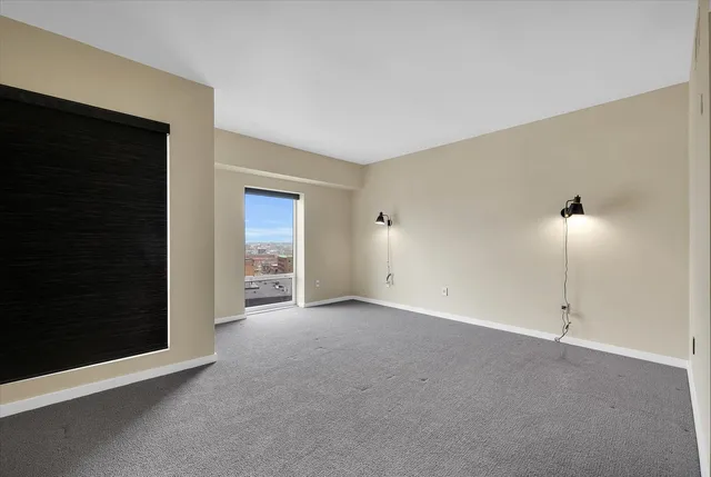 a view of an empty room with a fireplace