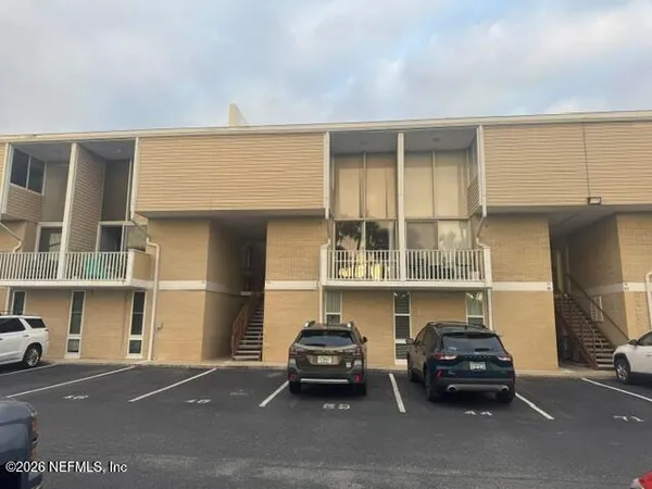 a kitchen with granite countertop a stove and a refrigerator